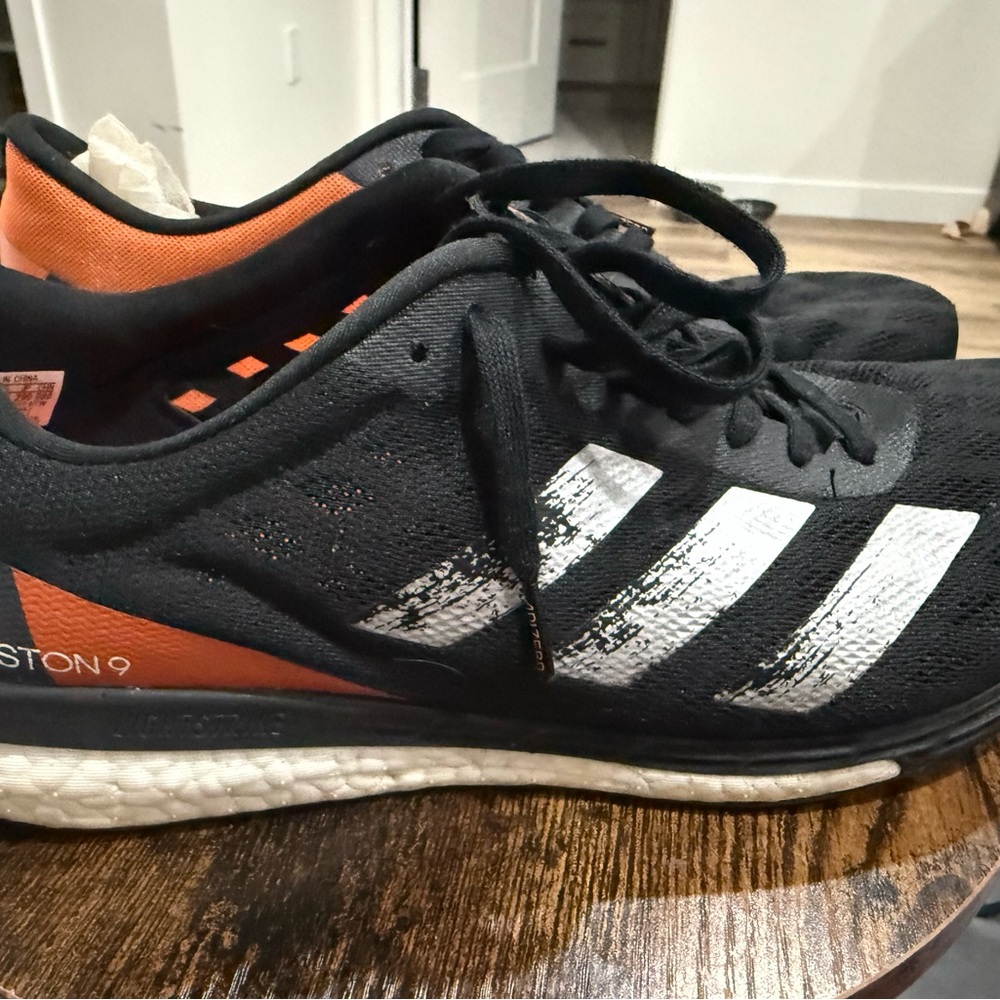 adidas Men’s Black Athletic Shoes with Orange Accent and White Stripes